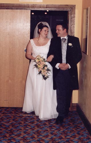 [Walking down the aisle...to the theme from 'The Avengers'!]